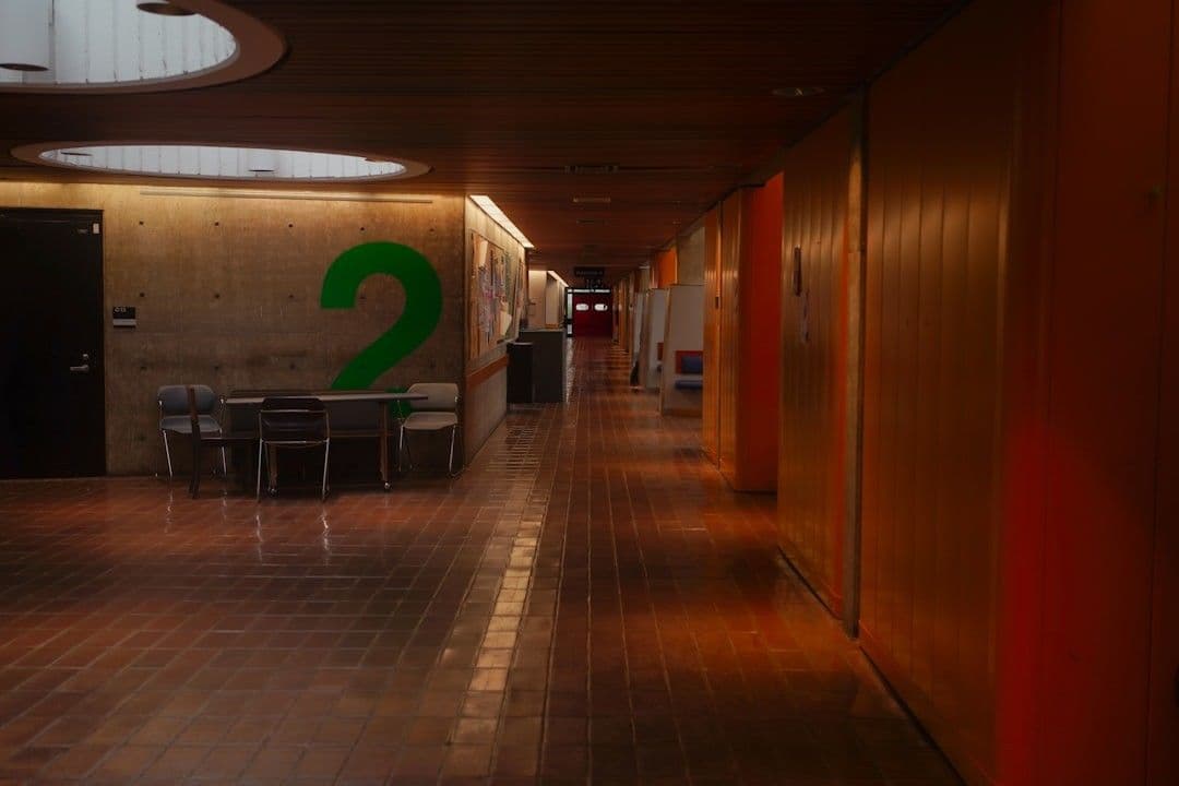 A long, empty hallway with colorful walls.