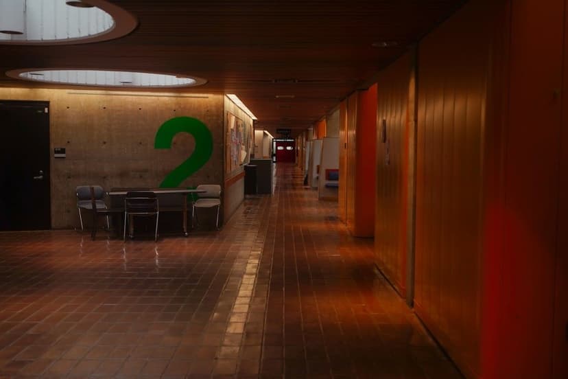 A long, empty hallway with colorful walls.