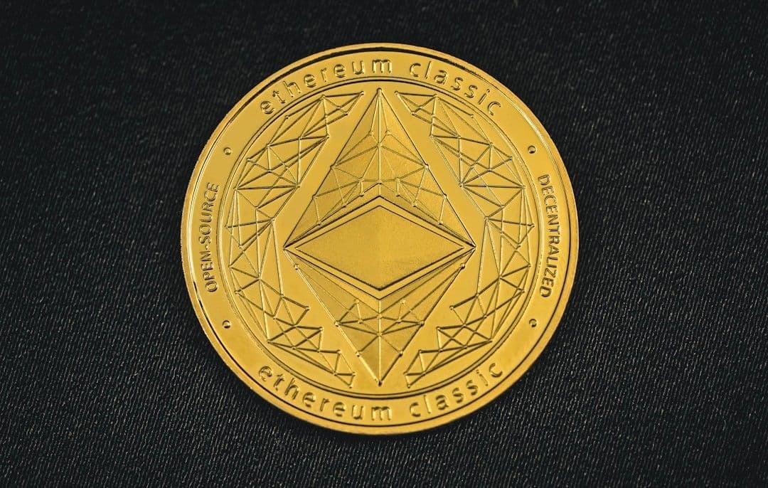 a close up of a coin on a black surface