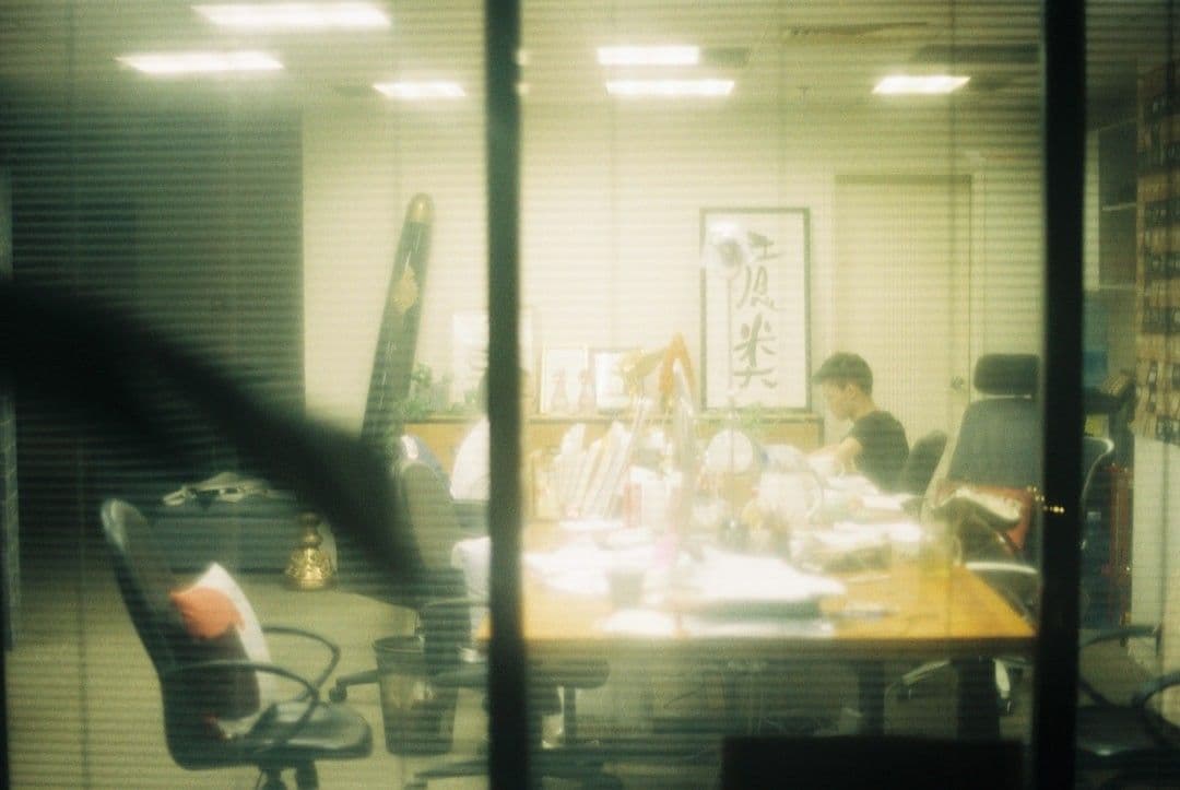 People gathered around a conference table in an office.