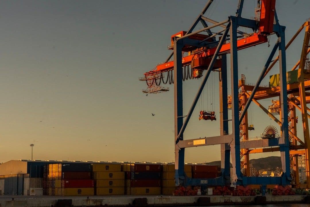 A large container ship with a crane on top of it