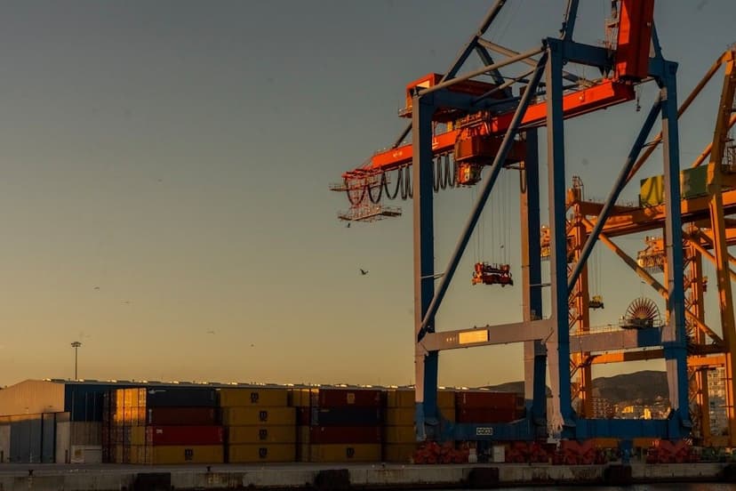 A large container ship with a crane on top of it