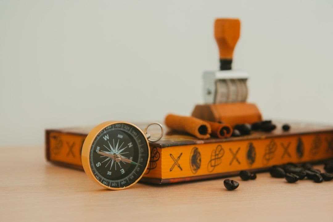 a clock sitting on top of a wooden table
