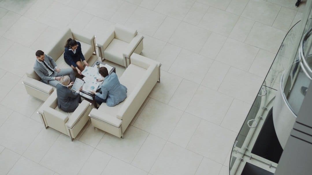 Business meeting around a table on sofas.