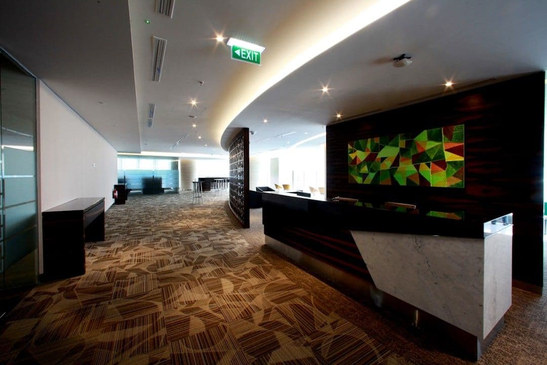 A modern office reception area is shown.