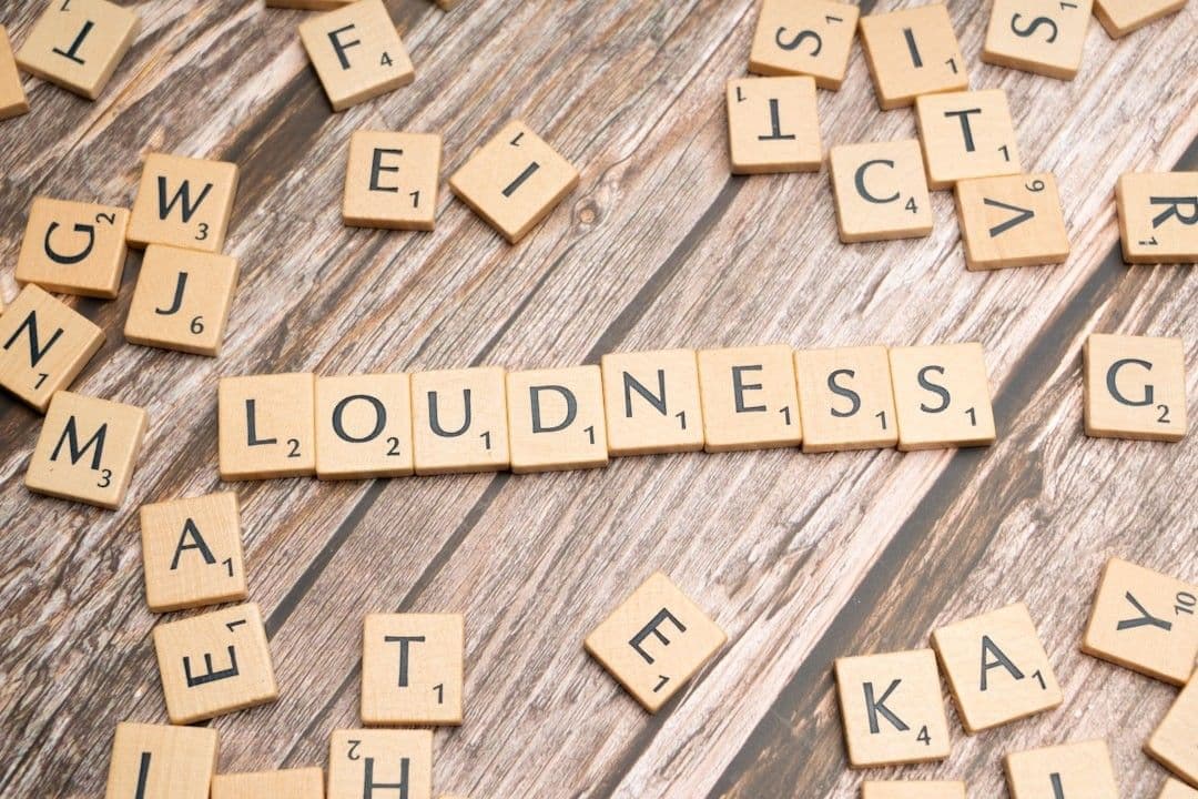 scrabble tiles spelling out the word loudness