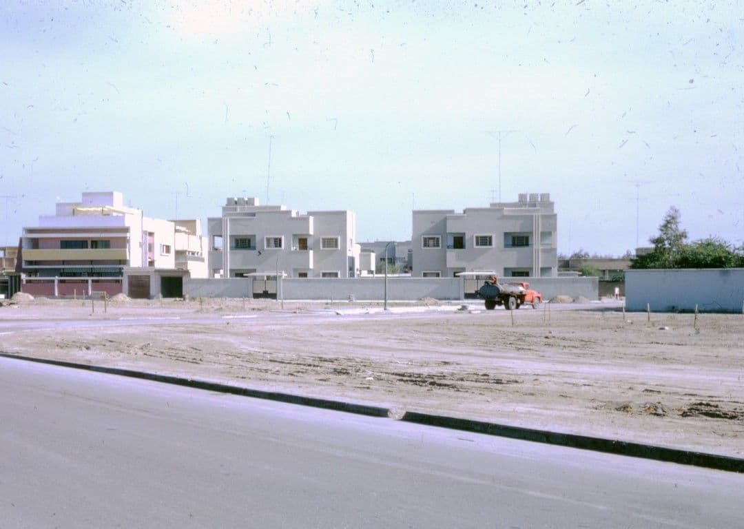 white concrete building near road during daytime