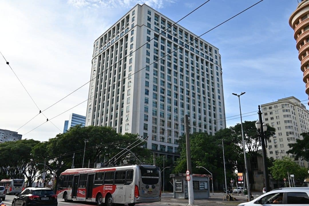 Modern tall office building with city traffic below