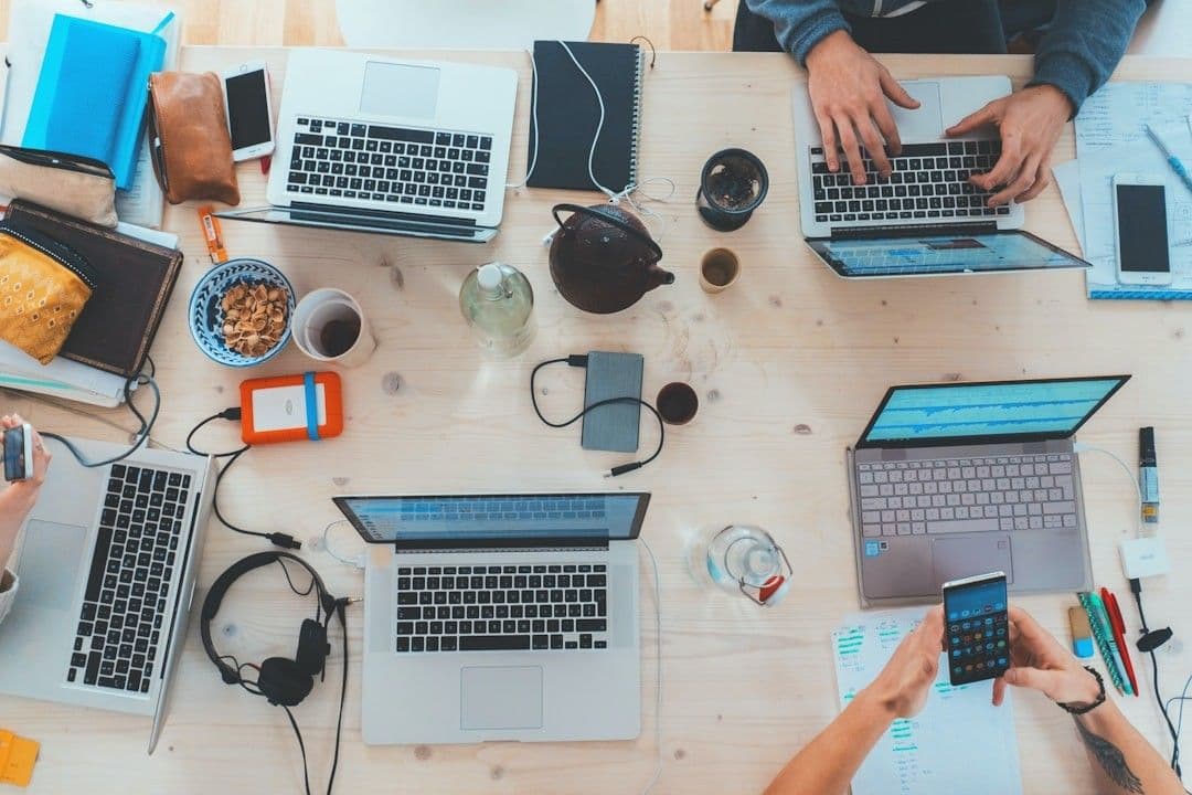 a table with laptops and food